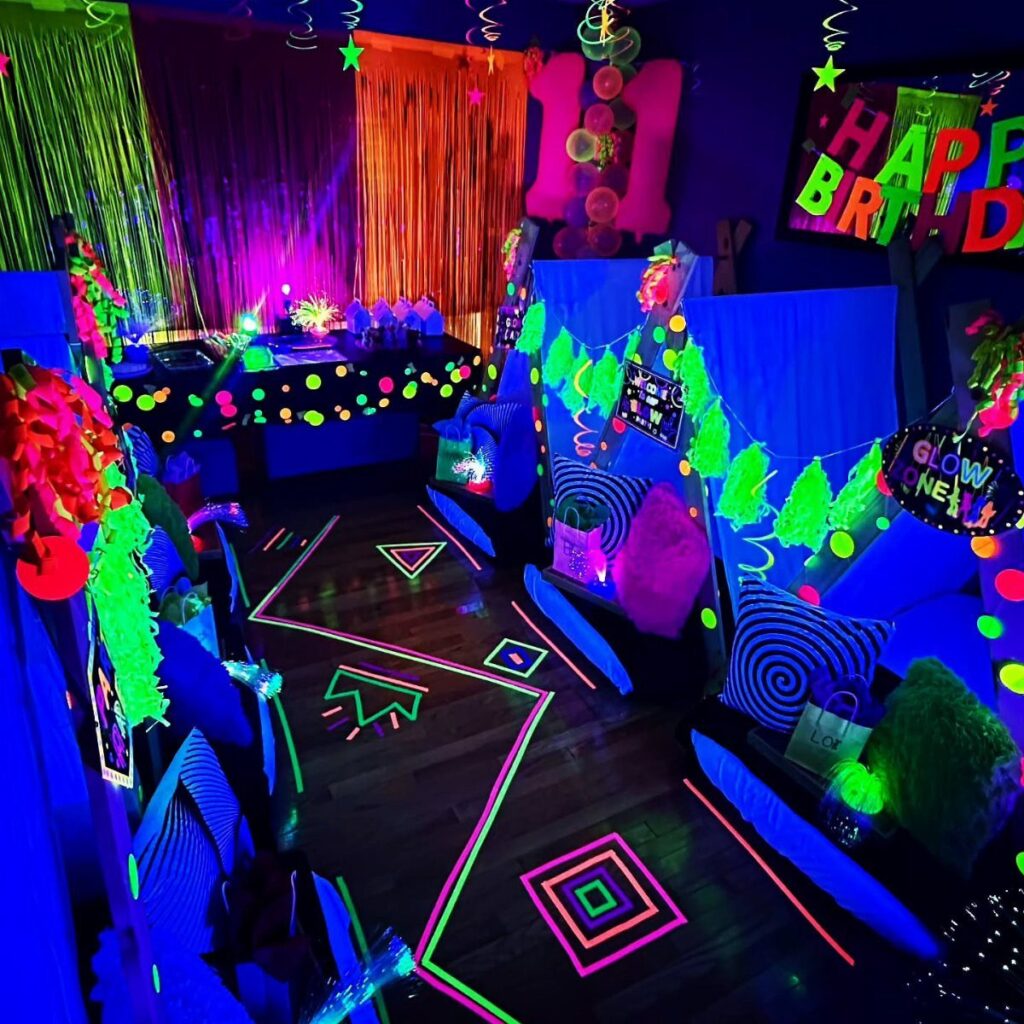 Neon party room with glowing floor shapes, blue lighting, and colorful decorations.
